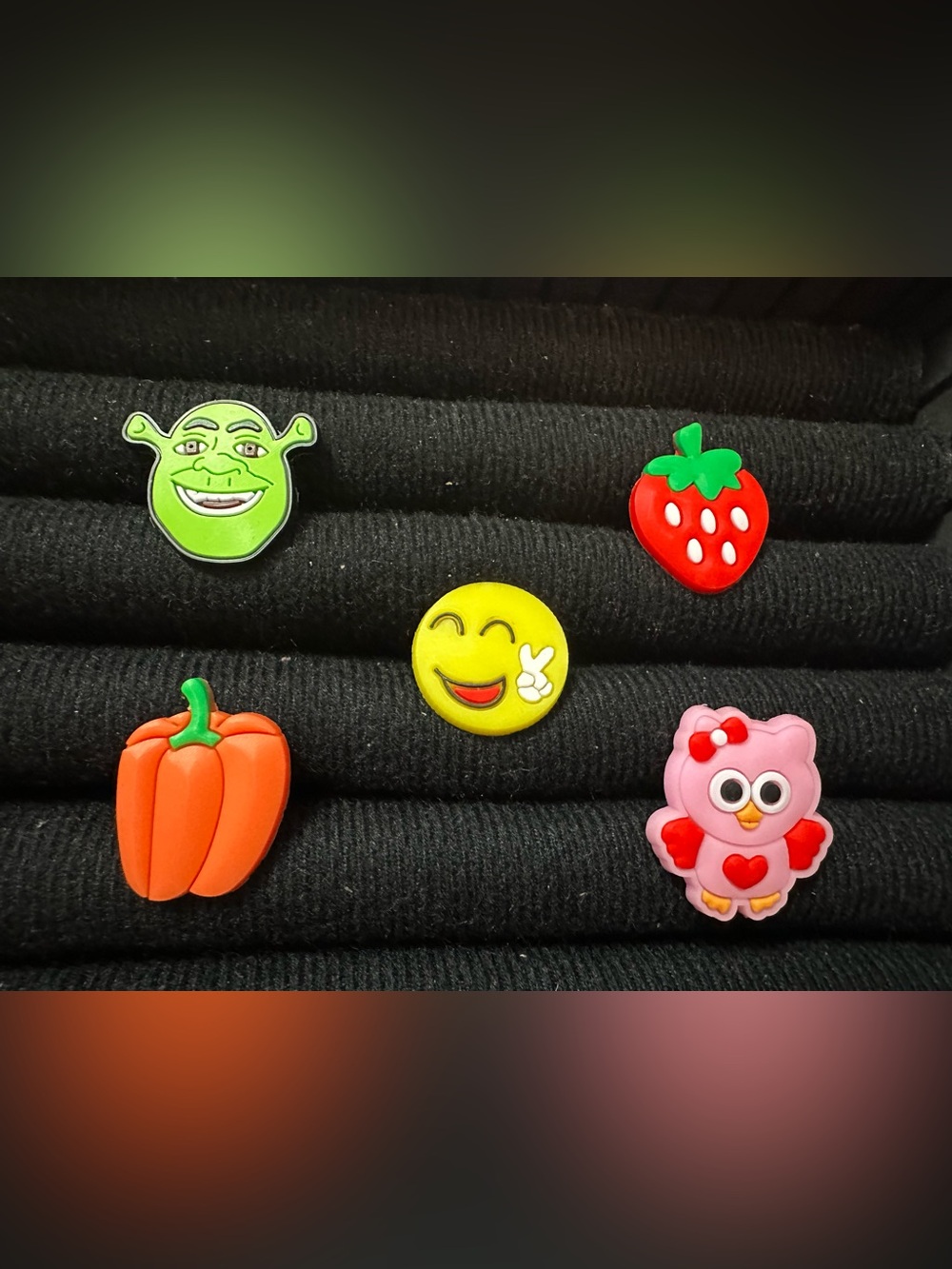 Shrek ,Bright yellow smiley and fruit shoe 
Charms